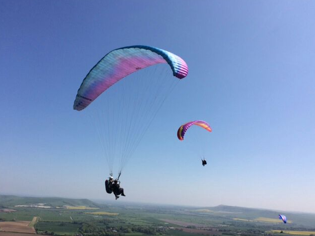 go paragliding locally to log cabin