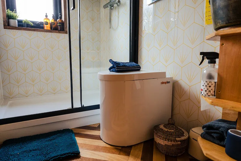 Compost toilet in the Skoolie Stays bathroom in West Sussex